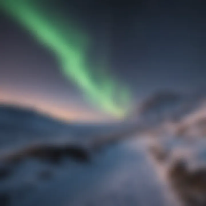 Aurora Borealis dancing in the night sky above snowy landscape